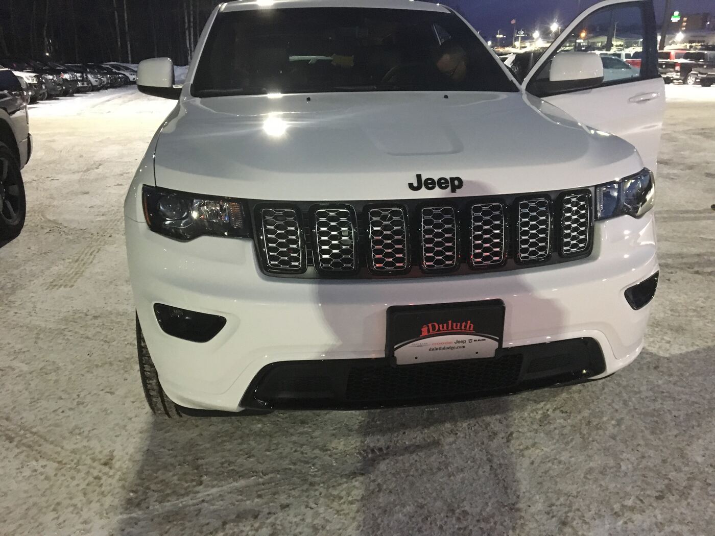 White Jeep Grand Cherokee after a windshield repair